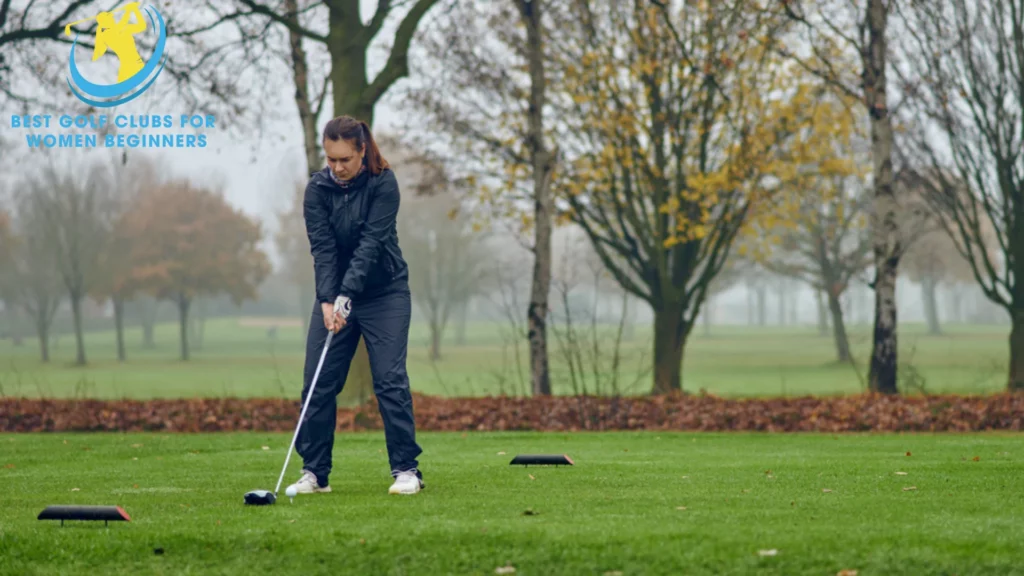 The image of a female golfer wearing cold golf gloves