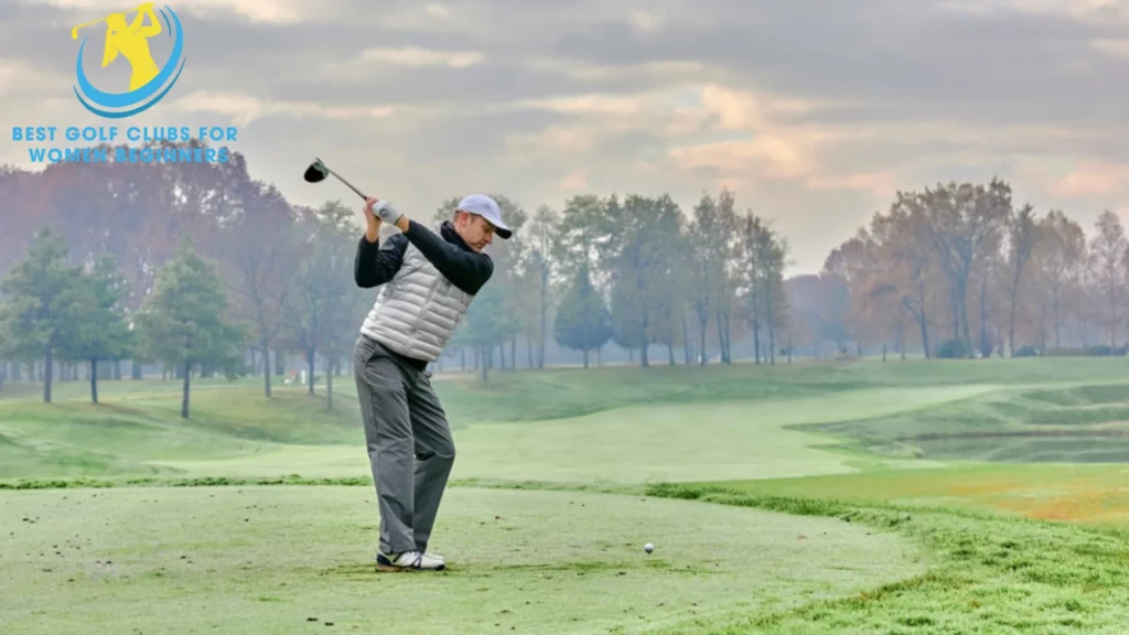 Image of a male golfer wearing winter golf shoes and winter top layers.